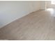 Spacious living area with light gray vinyl plank flooring at 327 W Fairhaven Rd, Kearny, AZ 85137