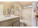 Clean bathroom with a tub, shower, and updated vanity at 3311 N 150Th Dr, Goodyear, AZ 85395