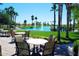 Relaxing patio seating area with views of a pond and fountain at 3311 N 150Th Dr, Goodyear, AZ 85395