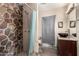 Bathroom features a stone shower and updated vanity at 3726 W Coolidge St, Phoenix, AZ 85019