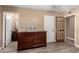 Bedroom with dresser and access to private bathroom at 3726 W Coolidge St, Phoenix, AZ 85019
