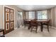 Bright dining area with a table and chairs near a door at 3726 W Coolidge St, Phoenix, AZ 85019