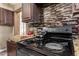 Close-up of kitchen stove with granite countertops at 3726 W Coolidge St, Phoenix, AZ 85019