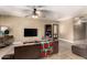 Living room with tiled floors, a tv, and access to other rooms at 3726 W Coolidge St, Phoenix, AZ 85019
