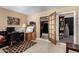 Home office with desk, chair, and view of kitchen at 3726 W Coolidge St, Phoenix, AZ 85019