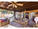 Covered patio with seating and ceiling fans at 3726 W Coolidge St, Phoenix, AZ 85019