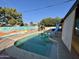 Inviting kidney-shaped pool with slide in backyard at 3726 W Coolidge St, Phoenix, AZ 85019
