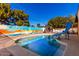 Inviting backyard pool with a unique painted wall and slide at 3726 W Coolidge St, Phoenix, AZ 85019