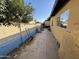 Side yard with concrete slab and lawnmower at 3726 W Coolidge St, Phoenix, AZ 85019