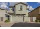 Two-story home with light green exterior and attached garage at 3910 E Turley St, Gilbert, AZ 85295