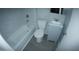 Updated bathroom with gray flooring, white tub, and vanity at 422 W Jamestown Rd, Kearny, AZ 85137