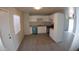 Newly remodeled kitchen featuring white cabinets and gray flooring at 422 W Jamestown Rd, Kearny, AZ 85137