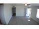 Spacious living room with gray flooring and access to exterior at 422 W Jamestown Rd, Kearny, AZ 85137