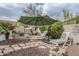 Relaxing backyard oasis with lounge chairs and umbrella at 4264 S Columbine Way, Gold Canyon, AZ 85118