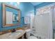 Bathroom with blue walls, granite vanity, and a bathtub at 4264 S Columbine Way, Gold Canyon, AZ 85118