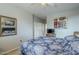 Bright bedroom with a mirrored dresser and floral bedding at 4264 S Columbine Way, Gold Canyon, AZ 85118