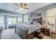 Main bedroom with large windows and a walk-in closet at 4264 S Columbine Way, Gold Canyon, AZ 85118