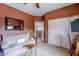 Cozy bedroom with a light grey couch and built in shelving at 4264 S Columbine Way, Gold Canyon, AZ 85118