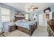 Main bedroom with wood platform bed and blue walls at 4264 S Columbine Way, Gold Canyon, AZ 85118