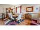 Formal dining room featuring a wood table and hardwood floors at 4264 S Columbine Way, Gold Canyon, AZ 85118