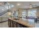 Spacious kitchen with granite countertops, stainless steel appliances, and island at 4264 S Columbine Way, Gold Canyon, AZ 85118