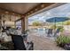 Covered patio with comfortable seating and fire pit at 4264 S Columbine Way, Gold Canyon, AZ 85118