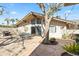 Charming backyard with stone patio, seating, and desert landscaping at 4301 E Montecito Ave, Phoenix, AZ 85018