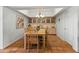 Bright dining room featuring terracotta floors, a chandelier and built-in cabinets at 4301 E Montecito Ave, Phoenix, AZ 85018