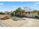 Well-maintained home with a spacious driveway and desert landscaping at 4301 E Montecito Ave, Phoenix, AZ 85018