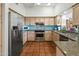 Well-equipped kitchen featuring stainless steel appliances and tile backsplash at 4301 E Montecito Ave, Phoenix, AZ 85018