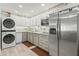 Bright kitchen featuring stainless steel appliances and ample cabinet space at 4301 E Montecito Ave, Phoenix, AZ 85018