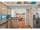 Charming kitchen showcasing stone countertops, terracotta flooring and adjoining dining area at 4301 E Montecito Ave, Phoenix, AZ 85018