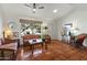 Inviting living room boasts tile flooring, a ceiling fan, and natural light at 4301 E Montecito Ave, Phoenix, AZ 85018