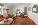 Cozy living room offering tile floors and a view into the front yard at 4301 E Montecito Ave, Phoenix, AZ 85018
