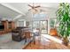Open-concept living space with tile floors, large windows, and backyard access at 4301 E Montecito Ave, Phoenix, AZ 85018