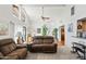 Bright living room with large windows, comfortable seating, and a glimpse into the dining area at 4301 E Montecito Ave, Phoenix, AZ 85018