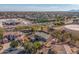 Aerial view of house, pool, and surrounding neighborhood at 4543 S Roy Rogers Way, Gilbert, AZ 85297