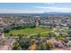 Aerial view of homes and community park with playground and basketball court at 4543 S Roy Rogers Way, Gilbert, AZ 85297