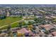 Aerial view showing neighborhood homes, park, and playground at 4543 S Roy Rogers Way, Gilbert, AZ 85297