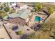 Aerial view of house with pool and trampoline at 4543 S Roy Rogers Way, Gilbert, AZ 85297