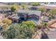 Aerial view of a house with a large backyard, pool, and trampoline at 4543 S Roy Rogers Way, Gilbert, AZ 85297
