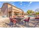 Backyard oasis with a fire pit and patio furniture at 4543 S Roy Rogers Way, Gilbert, AZ 85297