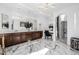 Luxurious bathroom with double vanity, marble floors, and soaking tub at 4543 S Roy Rogers Way, Gilbert, AZ 85297