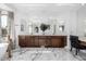Elegant bathroom with double vanity, marble flooring, and large mirror at 4543 S Roy Rogers Way, Gilbert, AZ 85297
