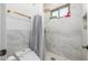 Clean bathroom with a walk-in shower and marble tile at 4543 S Roy Rogers Way, Gilbert, AZ 85297
