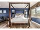 Elegant main bedroom featuring a four poster bed and hardwood floors at 4543 S Roy Rogers Way, Gilbert, AZ 85297