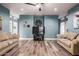 Spacious bonus room with light walls, wood flooring, and comfortable seating at 4543 S Roy Rogers Way, Gilbert, AZ 85297