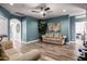 Bright bonus room with wood flooring, a ceiling fan and plenty of natural light at 4543 S Roy Rogers Way, Gilbert, AZ 85297
