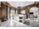 Elegant dining room with a large table, chandelier, and modern chairs at 4543 S Roy Rogers Way, Gilbert, AZ 85297