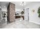 Elegant entryway with a stone accent wall and tile flooring at 4543 S Roy Rogers Way, Gilbert, AZ 85297